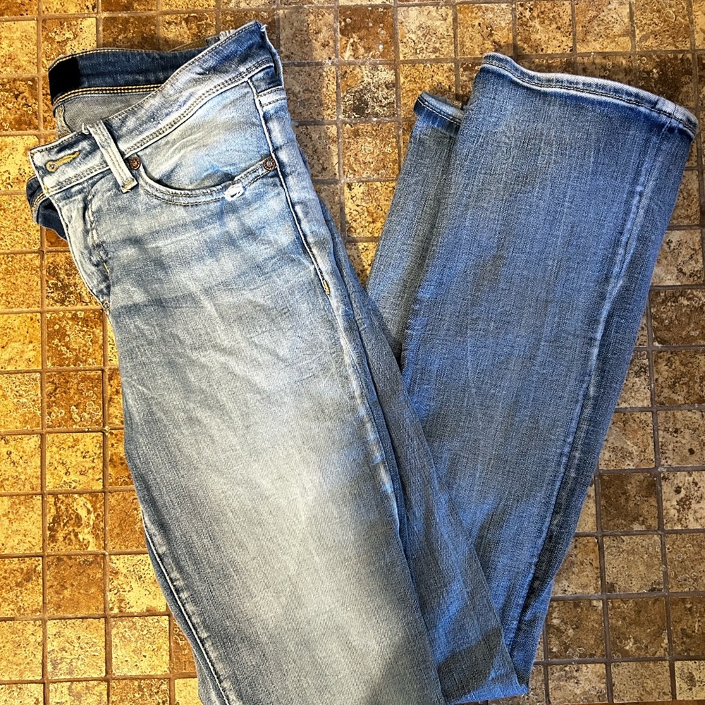 Buckle Black denim jeans with tummy control pocket